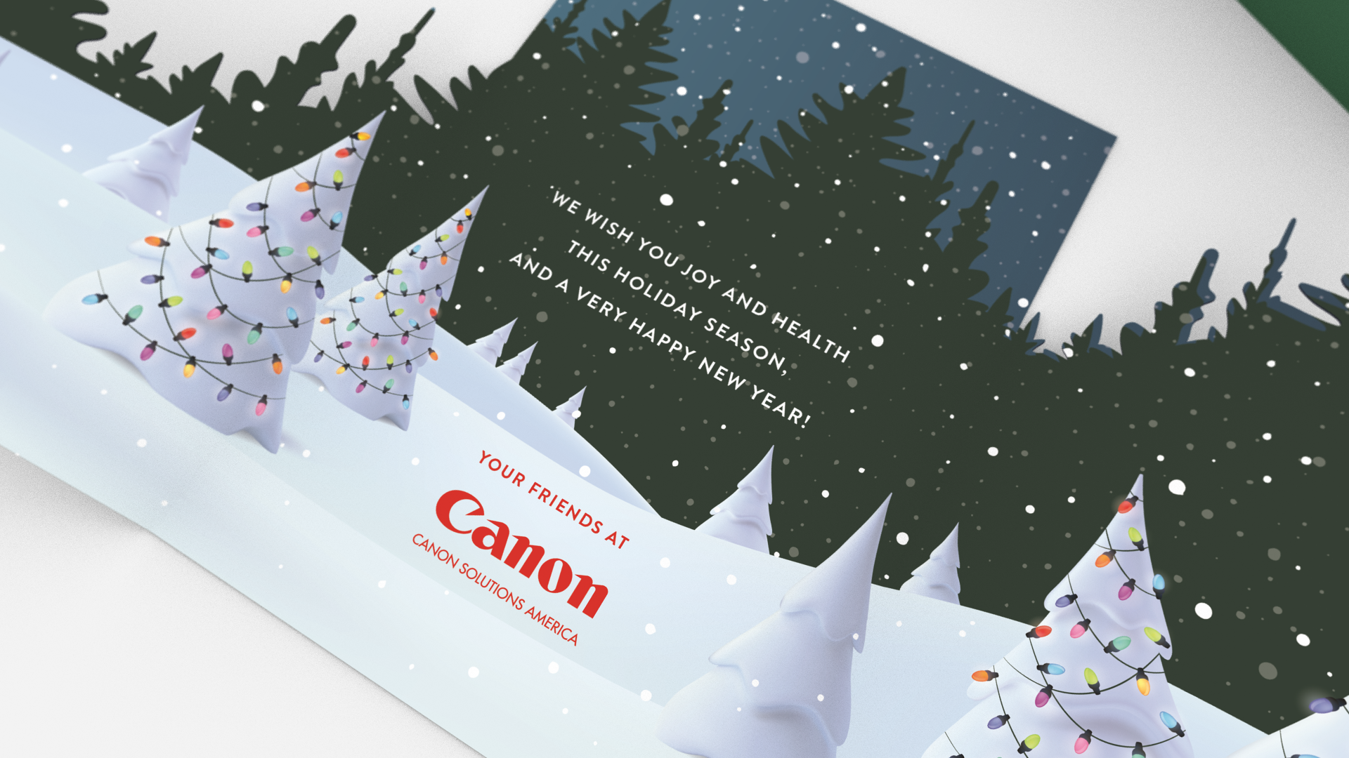 Holiday card featuring snowy Christmas trees