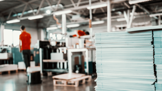 stack of printed papers in a print shop